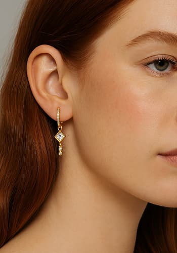 Rose‑gold hoops on model 2